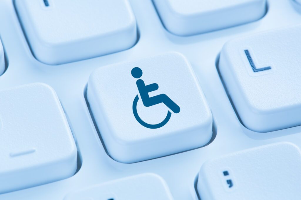 Accessibility symbol for people with disabilities on a keyboard.